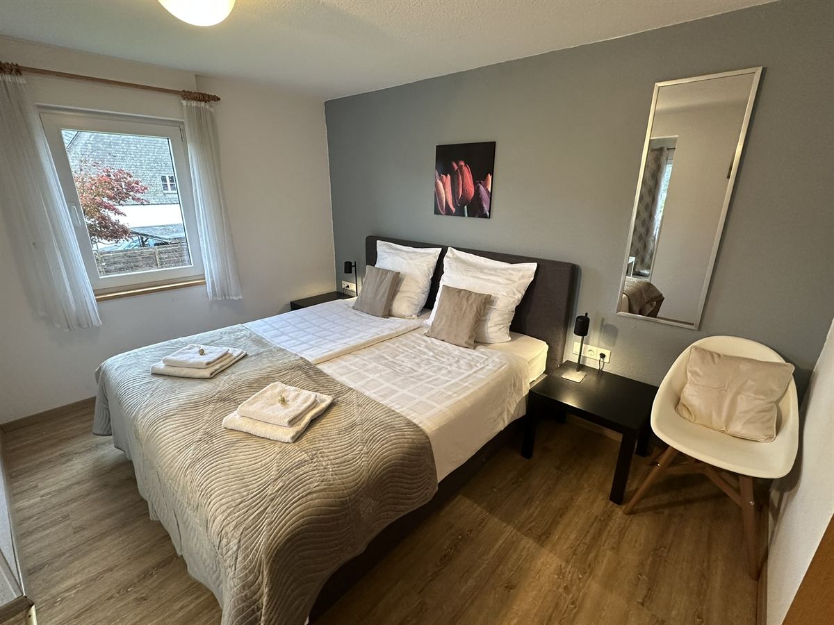 Lichte kamer met boxspringbed in pension Haus Astenalm